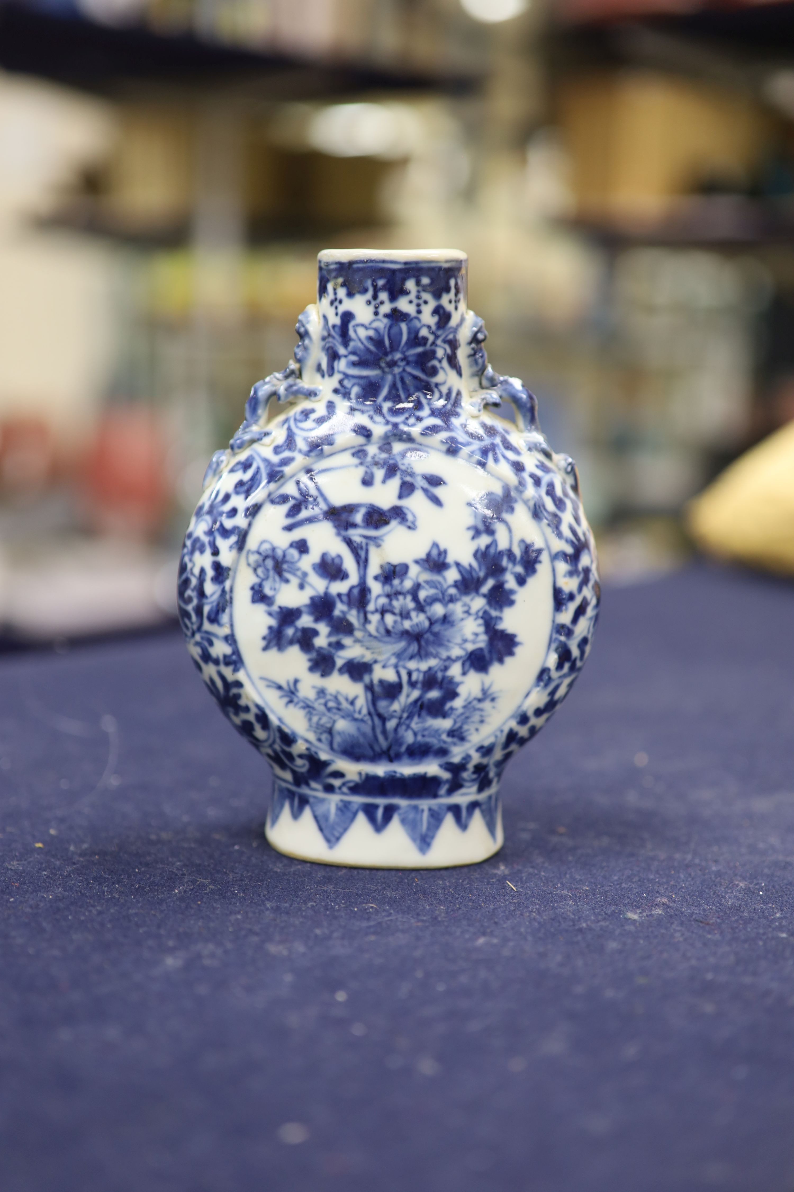 Two 19th century Chinese blue and white moon flasks and a teapot, tallest 21cm